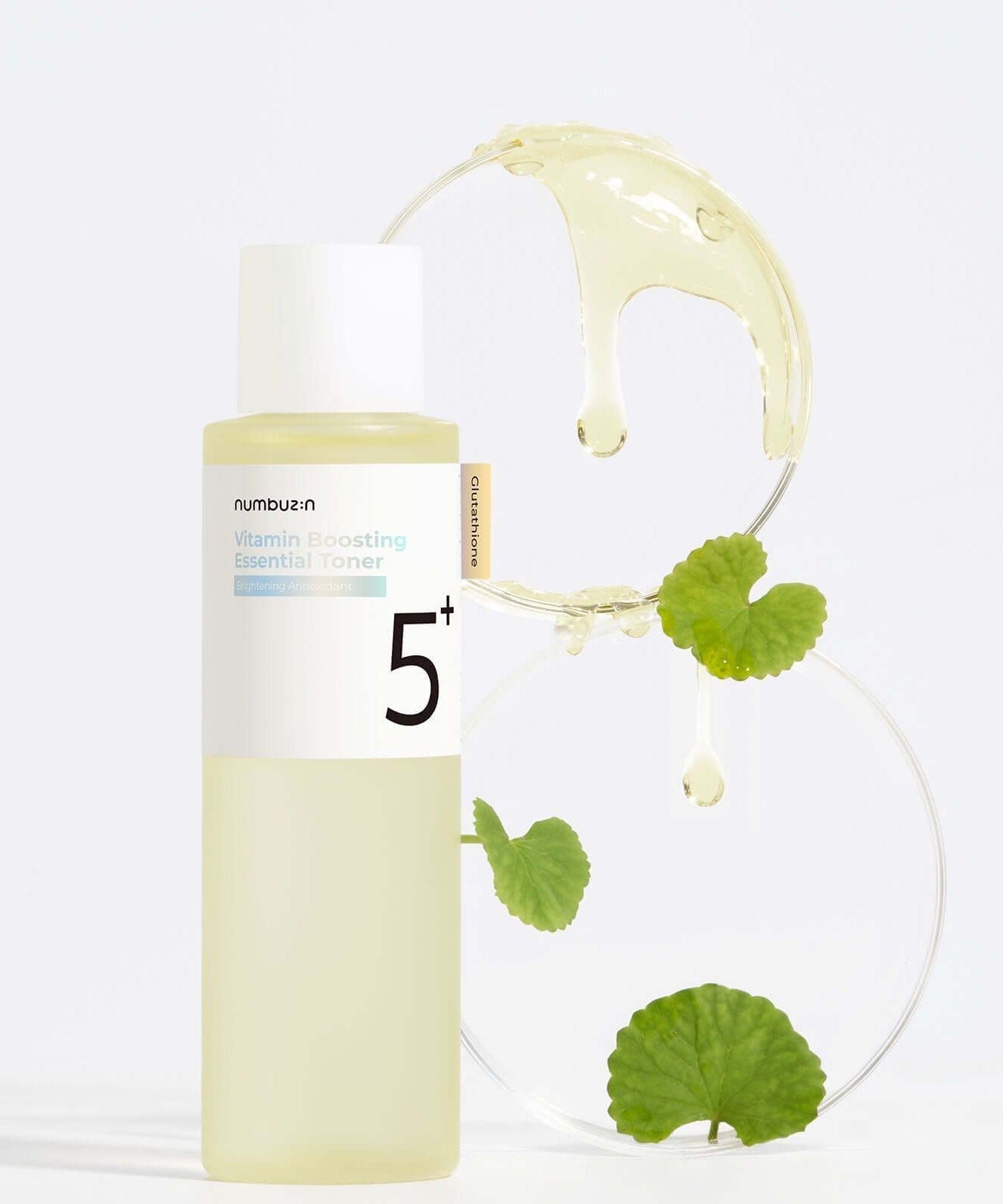 NUMBUZIN No.5 Vitamin Boosting Essential Toner bottle with fresh droplets and leaves for skincare