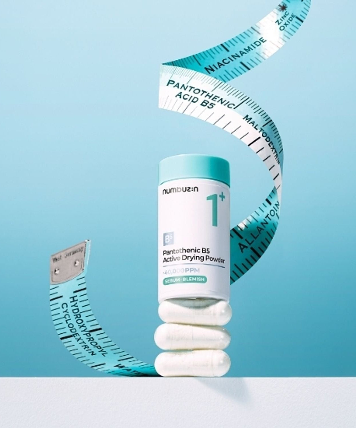NUMBUZIN No.1 Pantothenic Acid Active Up Dressing Powder 7g with measuring tape on light blue background