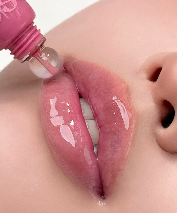 NUSE Nuzzle Reju Lip Gloss applied to lips for a glossy finish