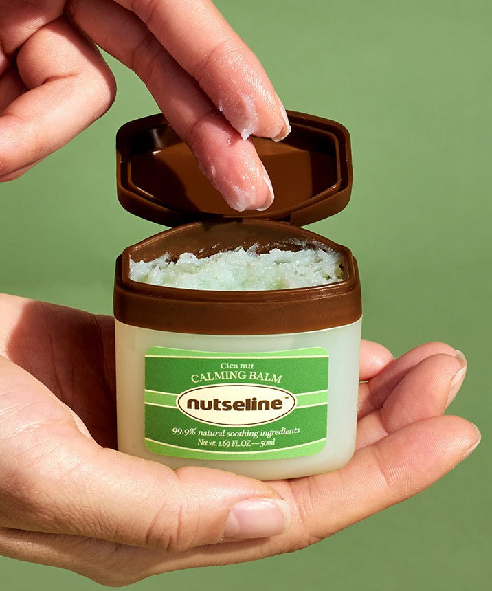 Person holding NUTSELINE Cica Nut Calming Balm Season 2 50ml