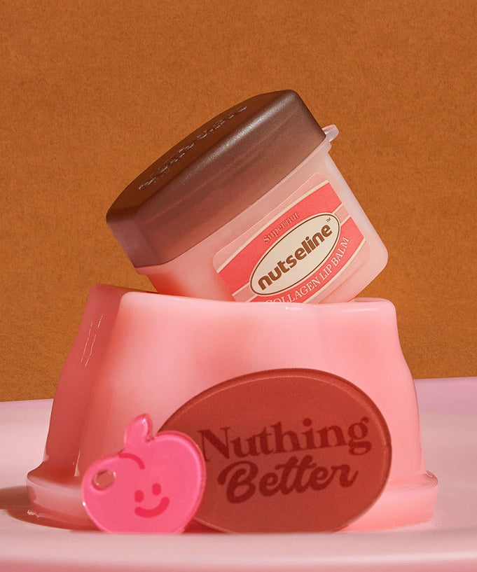 NUTSELINE Super Nut Collagen Keyring Lip Balm 11ml displayed with pink and brown accessories