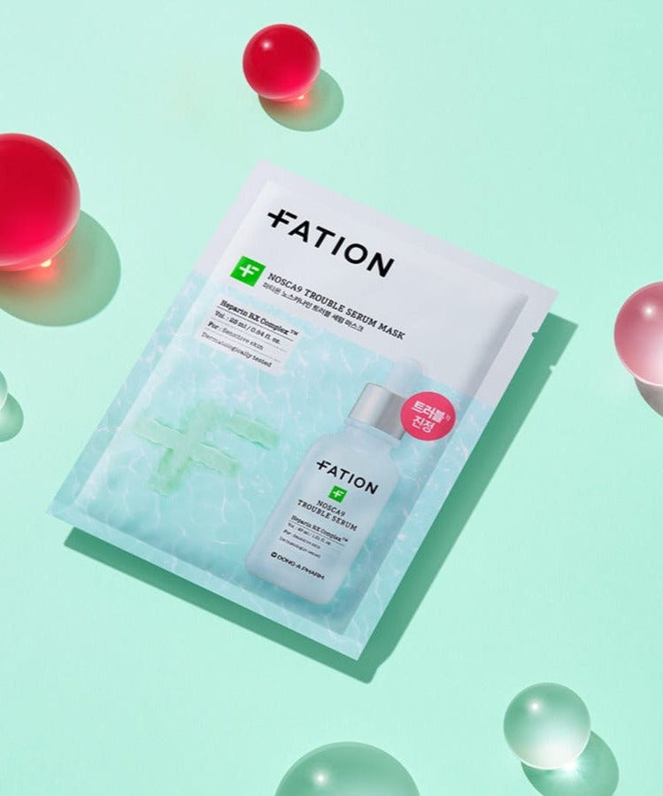 FATION Nosca9 Trouble Serum Mask on a mint background with colorful orbs, highlighting skincare benefits and packaging.