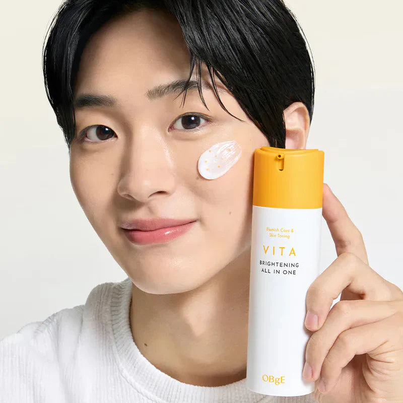 OBGE Vita Brightening All-in-One 150ml bottle held by smiling man applying cream on cheek, Gentleman Korea product shot