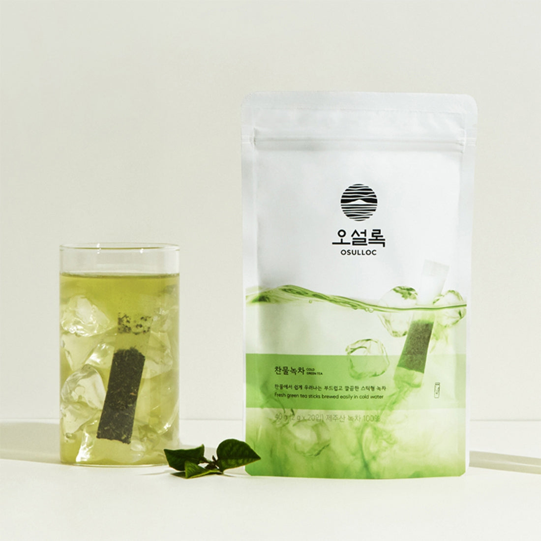 OSULLOC Cold green tea 20 P package next to glass of iced green tea
