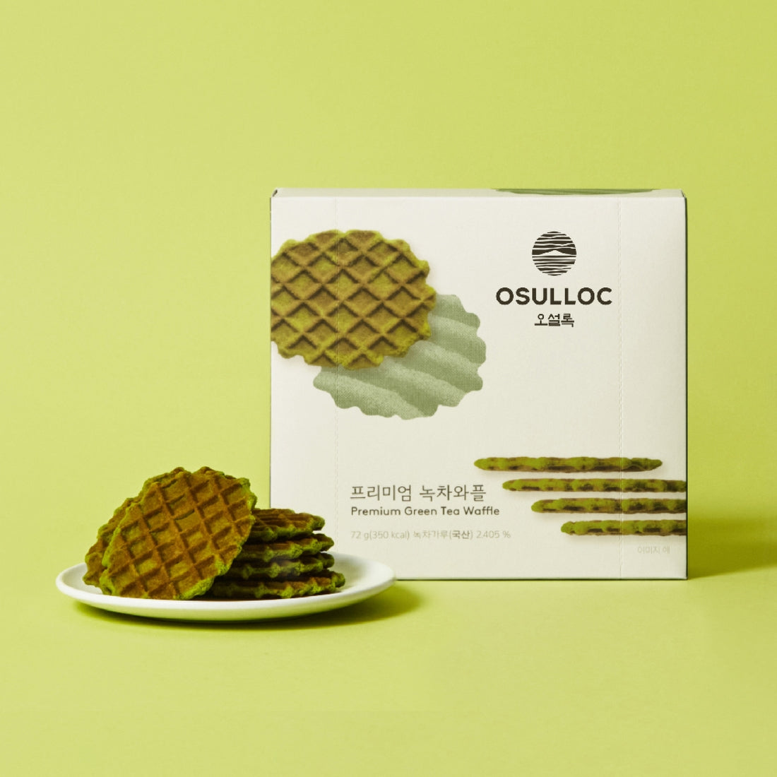 Box and plate of OSULLOC Premium Green Tea Waffle 72g against a green background.