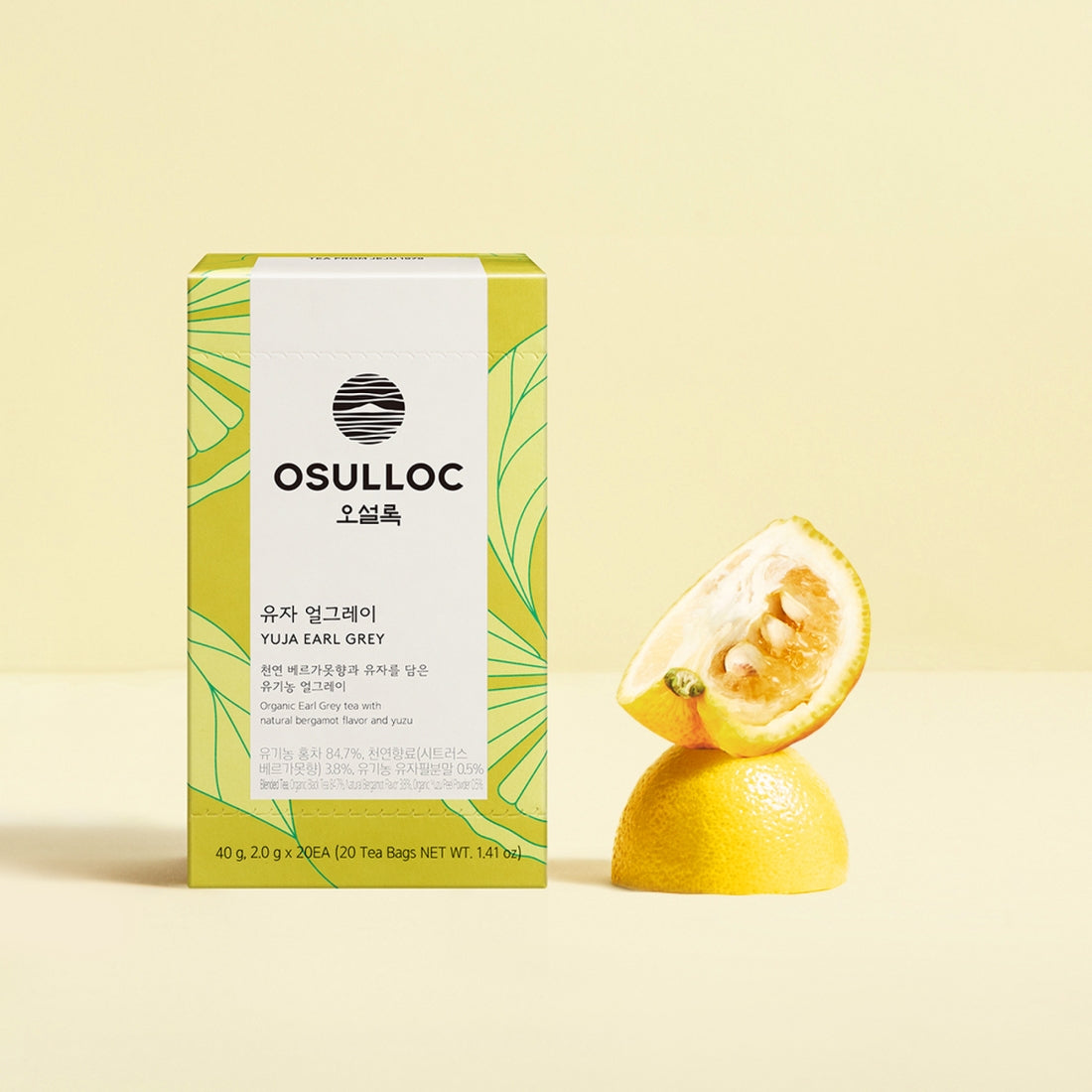 OSULLOC Yuja Earl Grey 20 p. tea box with fresh citrus on a light background