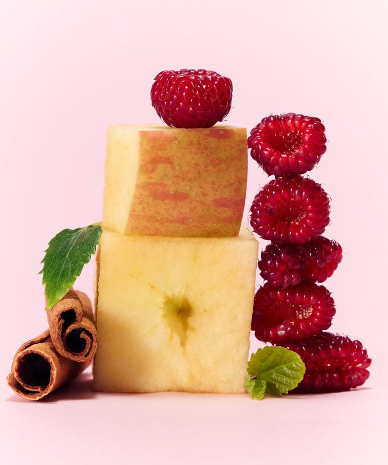 Fresh raspberries and apple with cinnamon, ingredients in OSULLOC Berry Garden Green Tea 10 P on a pastel background.