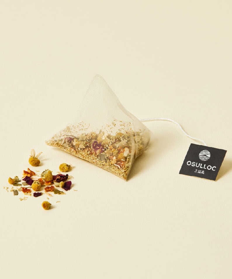OSULLOC Chamomile Blend 10 p herbal tea bag with loose chamomile and floral ingredients on display.