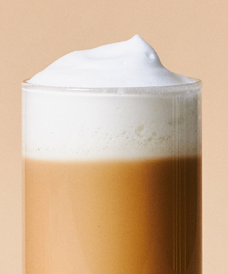 Creamy OSULLOC Earl Grey Milk Tea 10 p in a glass with frothy top.