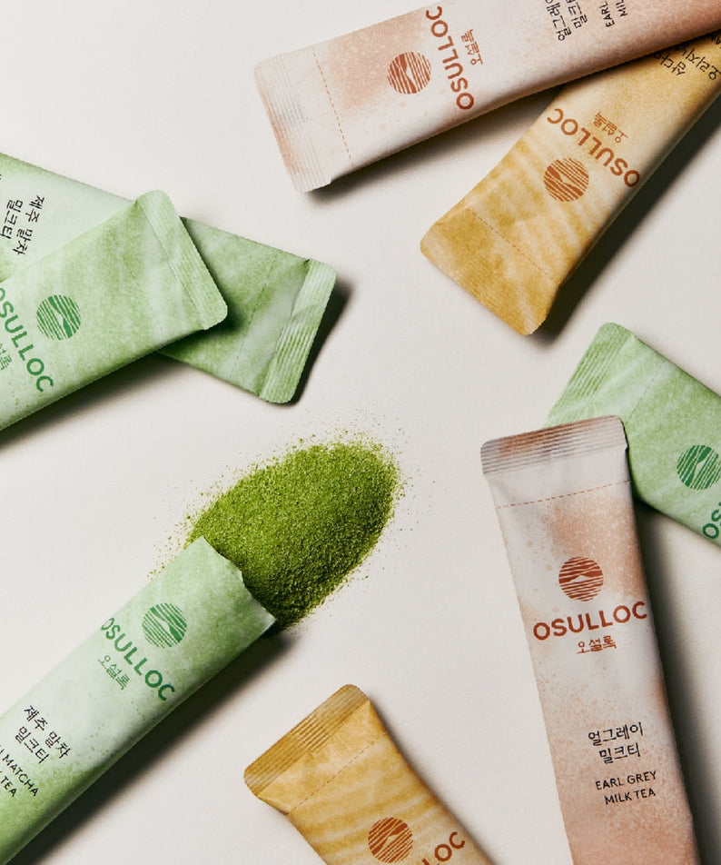 OSULLOC Earl Grey Milk Tea 10 p sachets displayed with matcha tea powder spill