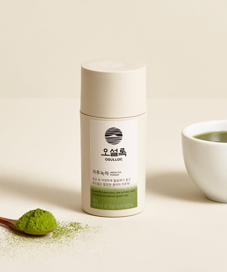 OSULLOC Green Tea Powder 40g container with spoon and cup of green tea on a beige background