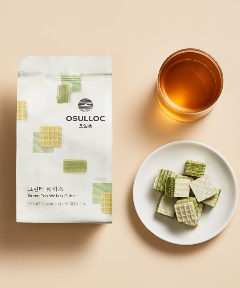OSULLOC Green Tea Wafers 100g package with a cup of tea and a plate of wafers