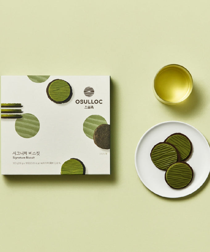 OSULLOC Signature Biscuits 10 P box with green tea and plate of biscuits on light green background