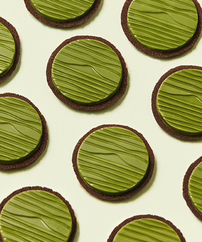 OSULLOC Signature Biscuits 10 P arranged in a grid pattern, showcasing green textured tops on round cookies.