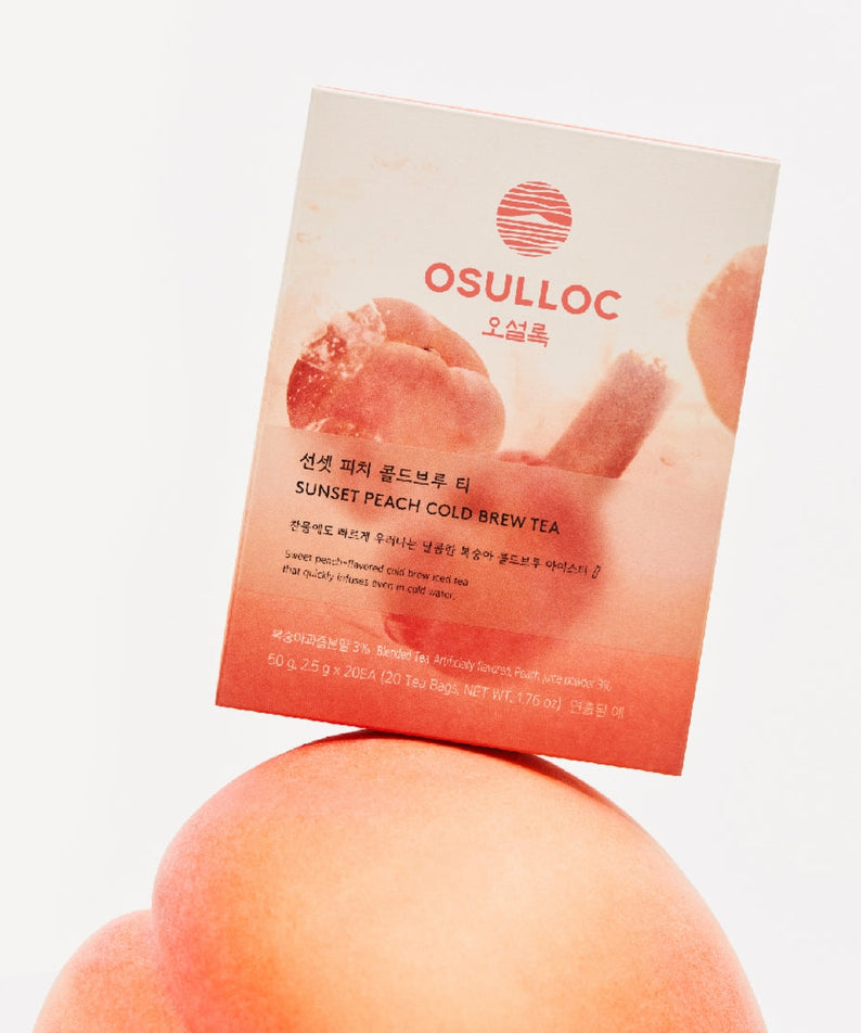 OSULLOC Sunset Peach Cold Brew Tea 20 P packaging on a peach background, highlighting the product's natural fruit infusion and elegance.