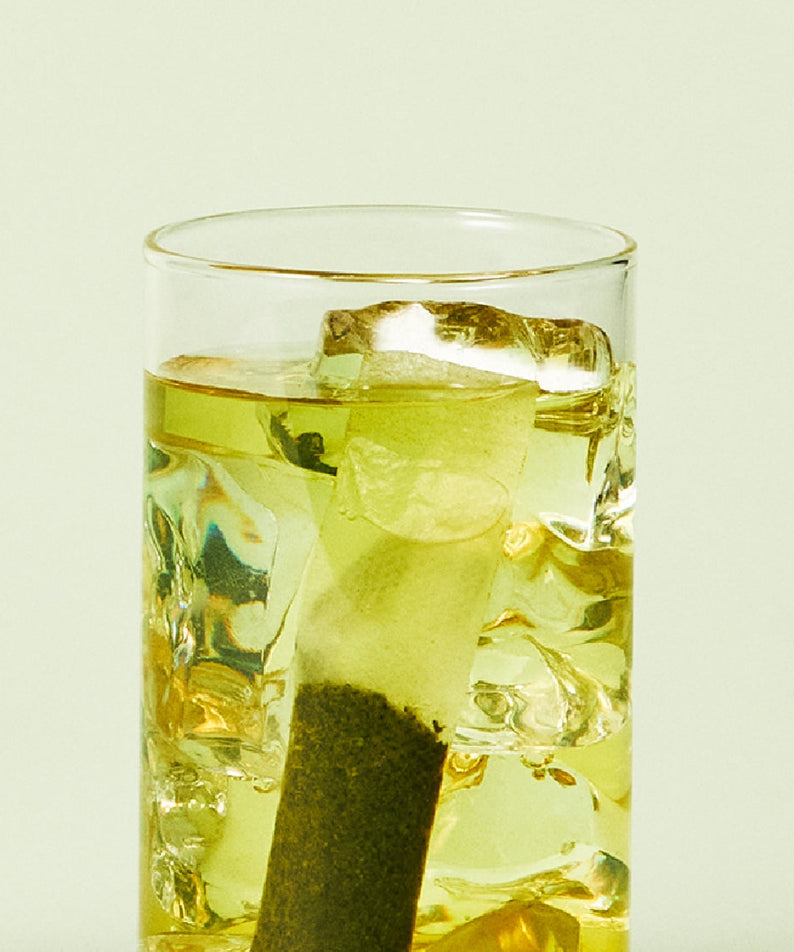 Glass of OSULLOC Sunshine Muscat Cold Brew Tea 20 p with ice cubes