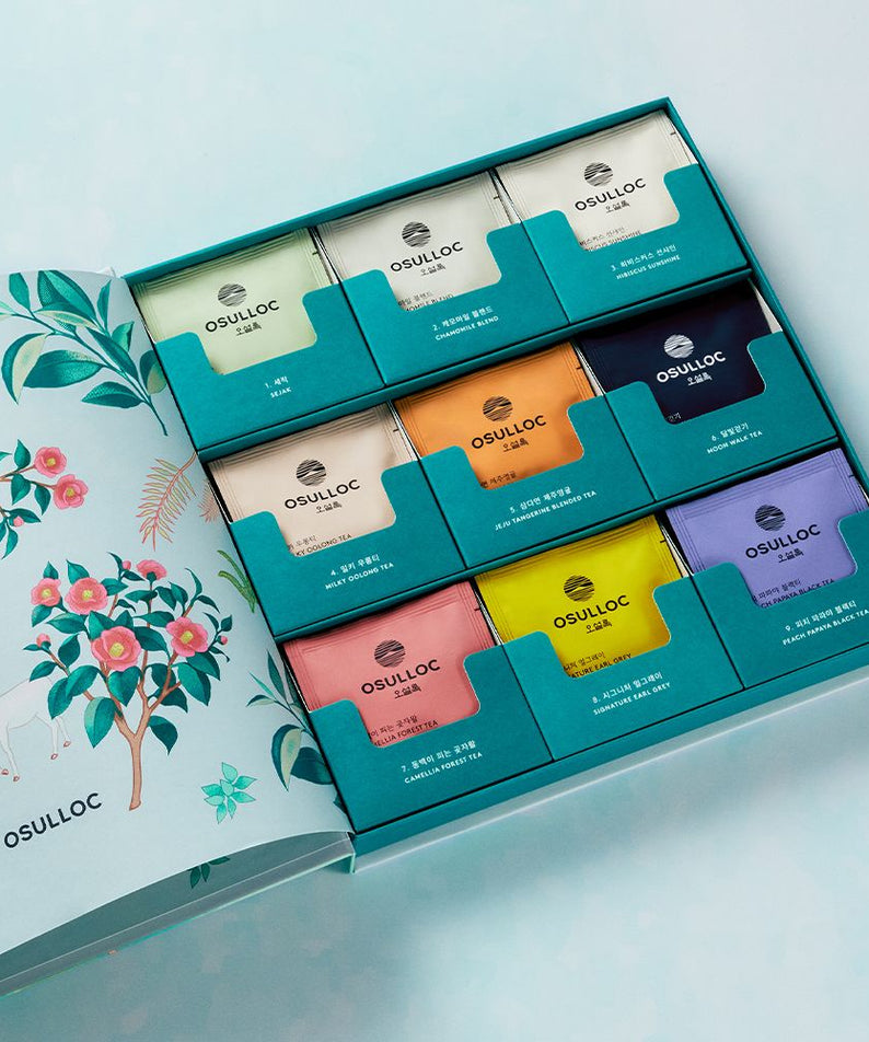 Assorted tea collection in OSULLOC Tea Garden Set 2025, featuring colorful packaging inside an open gift box.