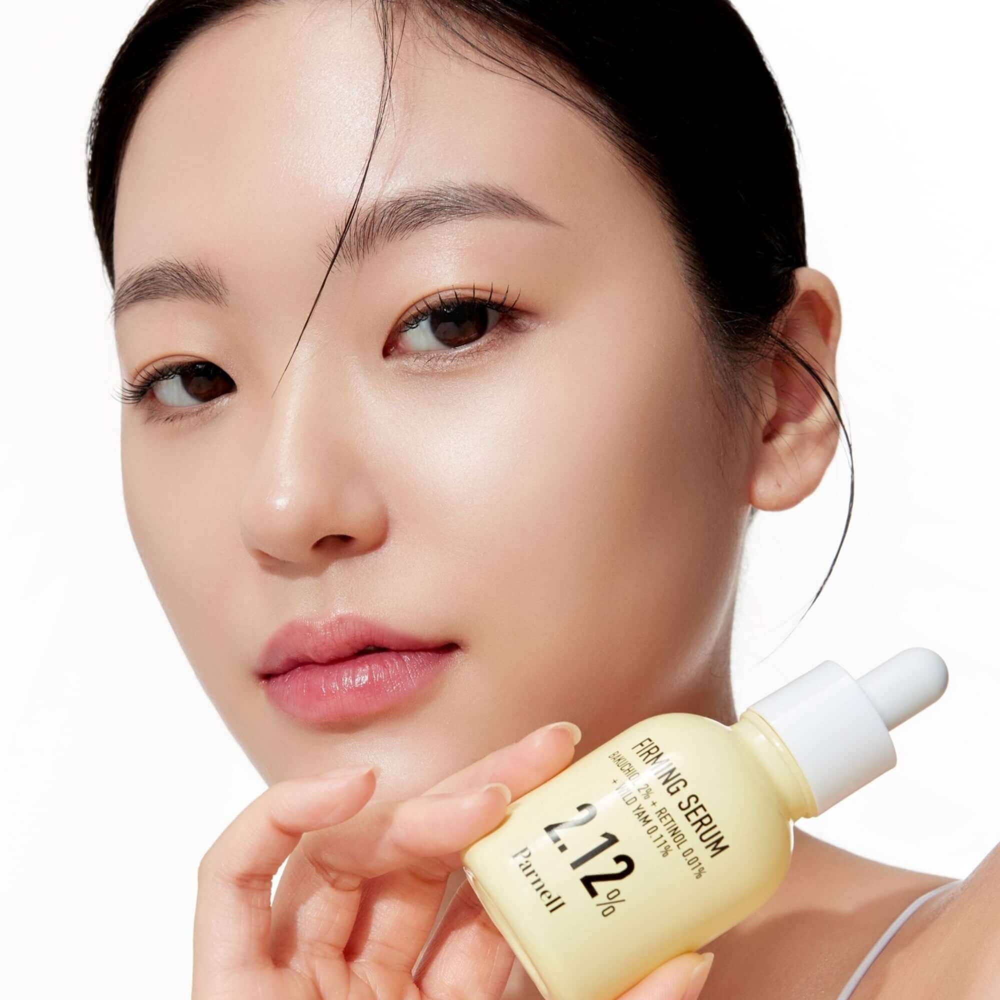 PARNELL Bakuchiol Wild Yam 2.12 Firming Serum 30ml shown with model for skincare routine