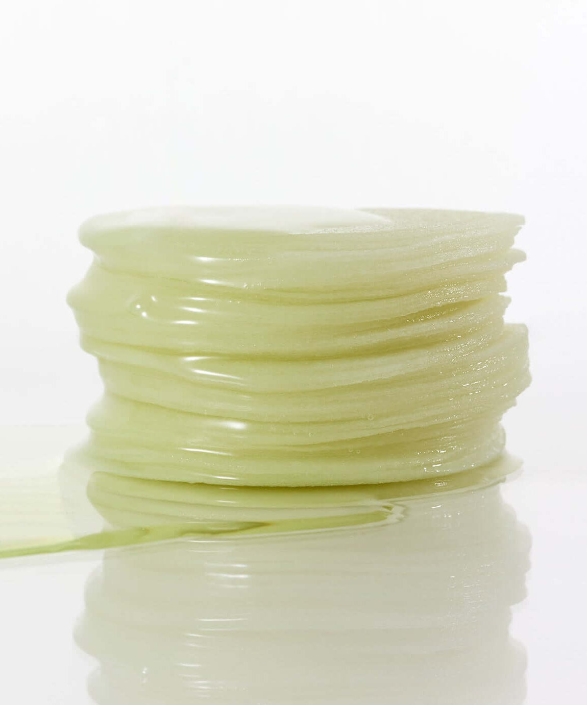 Stack of soothing PARNELL Panthenol Heartleaf Calming Pad 60pads on a reflective surface