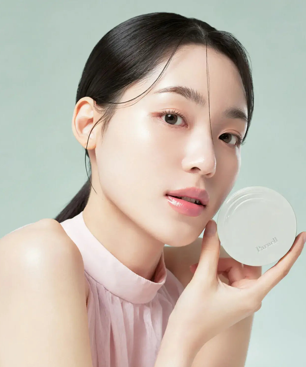 Model displaying PARNELL Serum In High Glow Cushion 15g