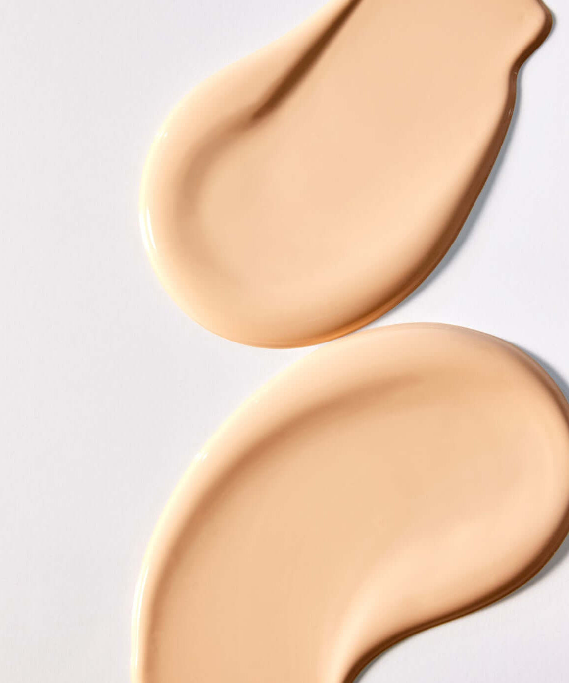 Texture swatch of PARNELL Serum In High Glow Cushion 15g showing creamy beige liquid on white background.