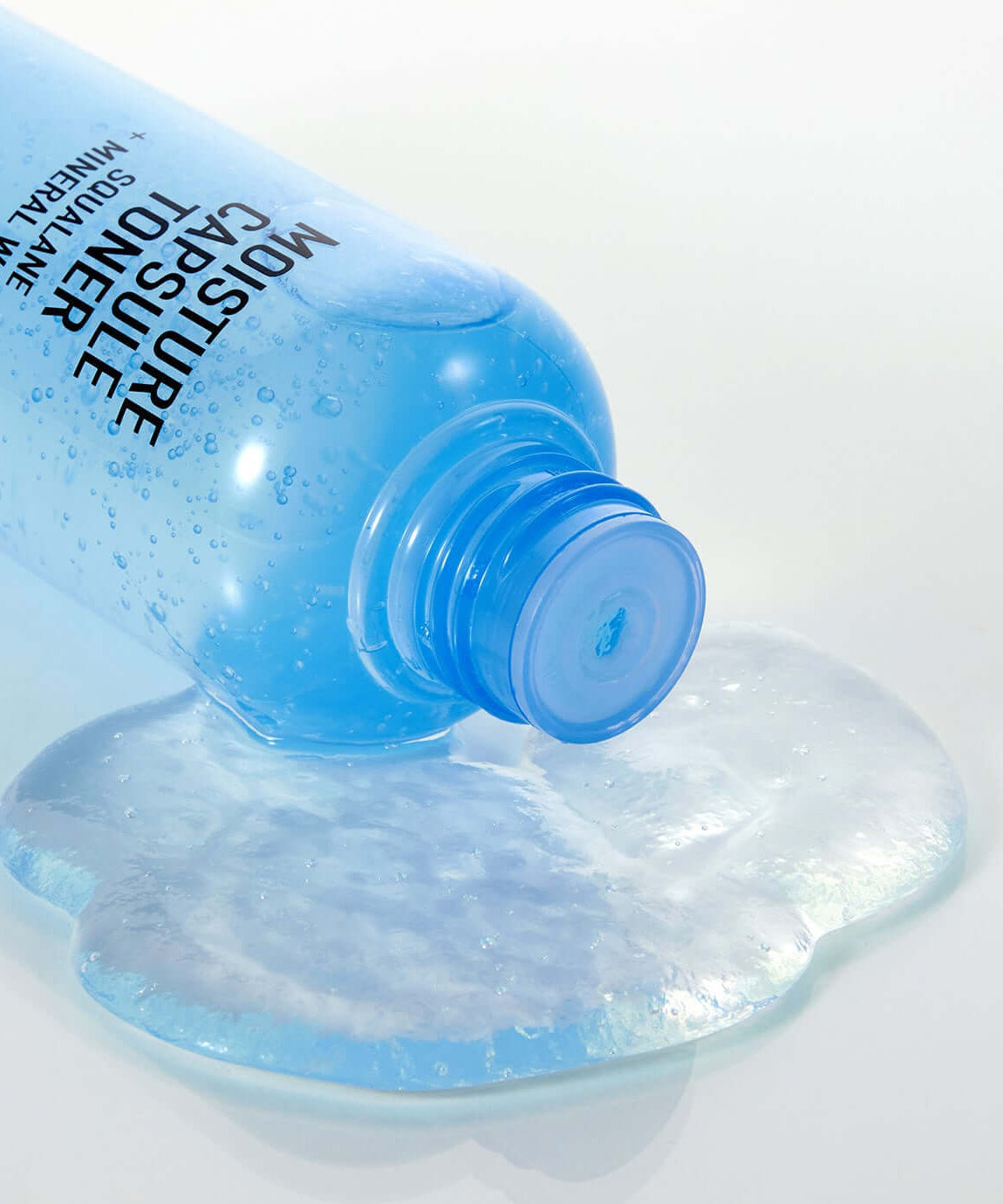 PARNELL Squalane Mineral Water Moisture Capsule Toner 200ml bottle with liquid spilled on surface