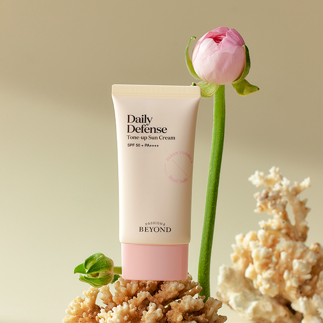 PASSION & BEYOND Daily Defense Tone-Up Sun Cream SPF50+ 50ml with floral background, highlighting skincare protection and tone-up benefits.