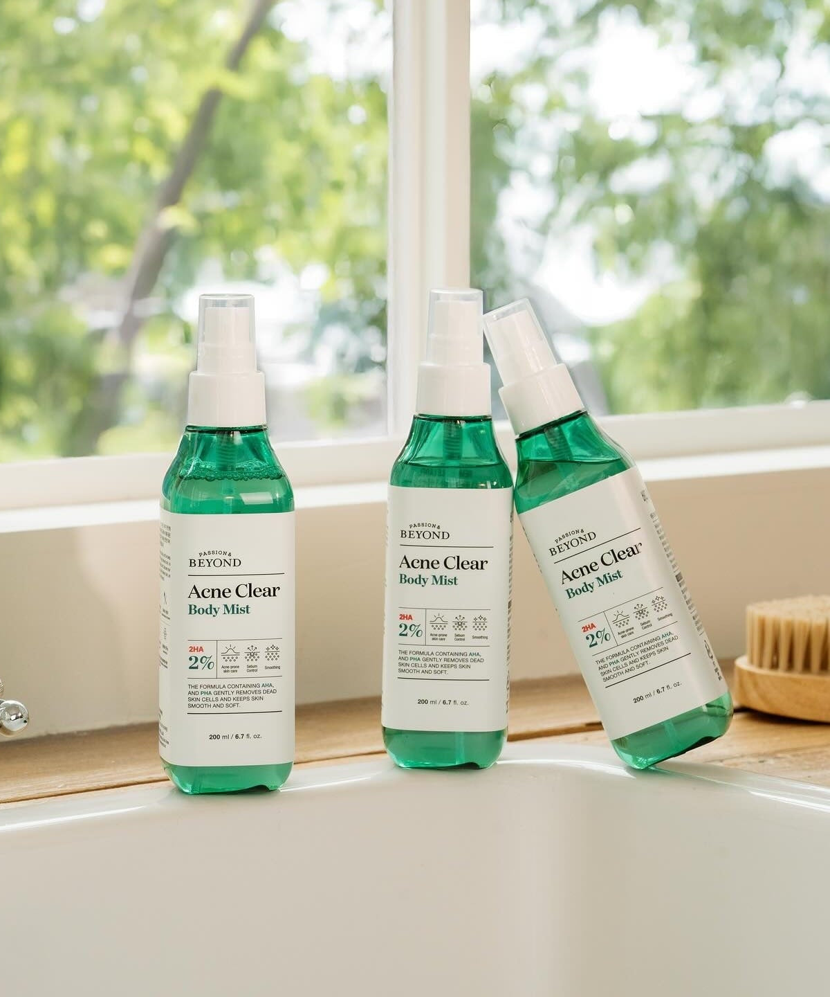 PASSON&BEYOND Acne Clear Body Mist 200ml bottles displayed on a windowsill for acne care
