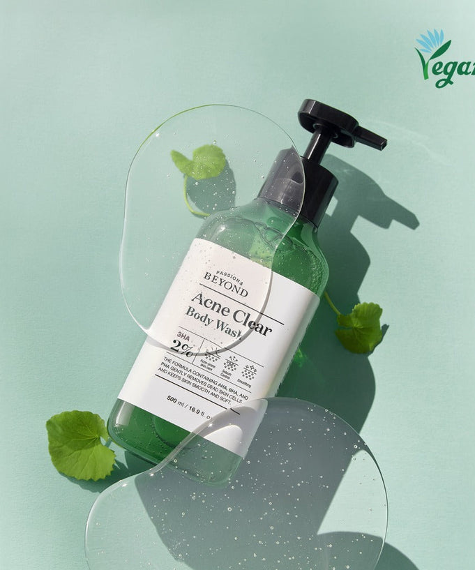 PASSON&BEYOND Acne Clear Body Wash 500ml bottle with green leaves and clear gel overlay, vegan product on mint background.