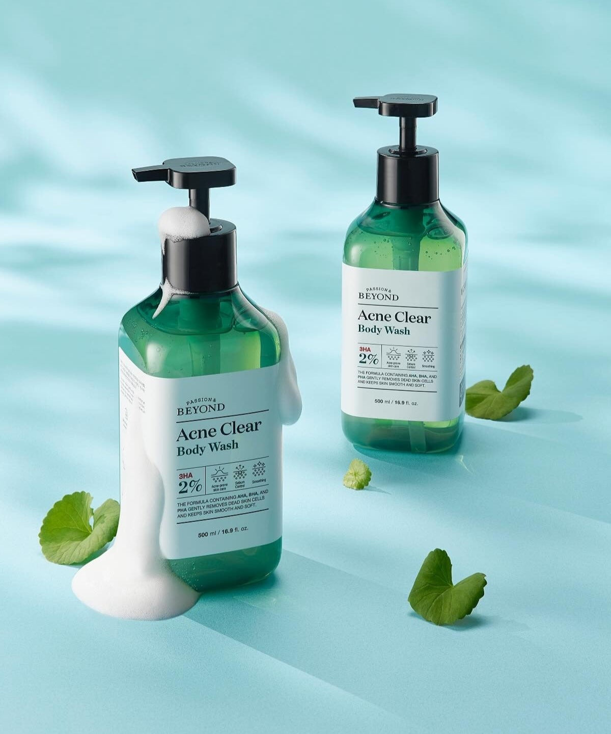 PASSON&BEYOND Acne Clear Body Wash 500ml bottles on light blue background with green leaves.