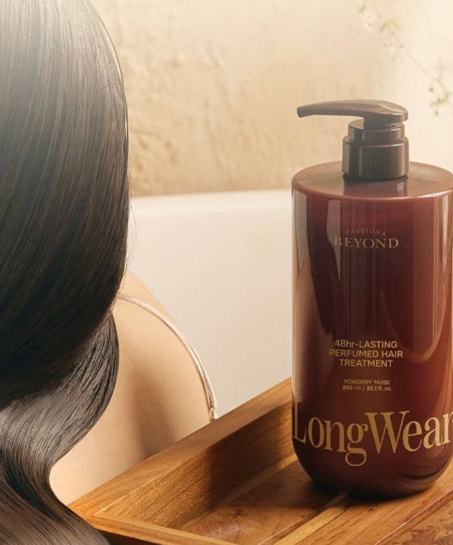 PASSON&BEYOND LongWear 48hr Lasting Perfumed Hair Treatment 950ml bottle next to silky hair in a serene bathroom setting.