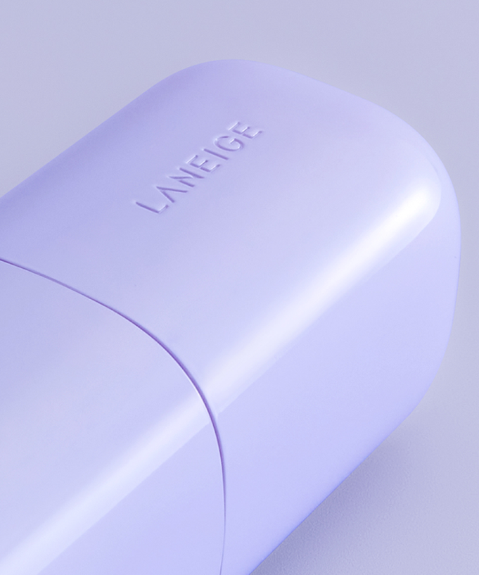 LANEIGE Skin Veil Base SPF28/PA++ 30ml bottle in light lavender, close-up view showcasing sleek design and branding.