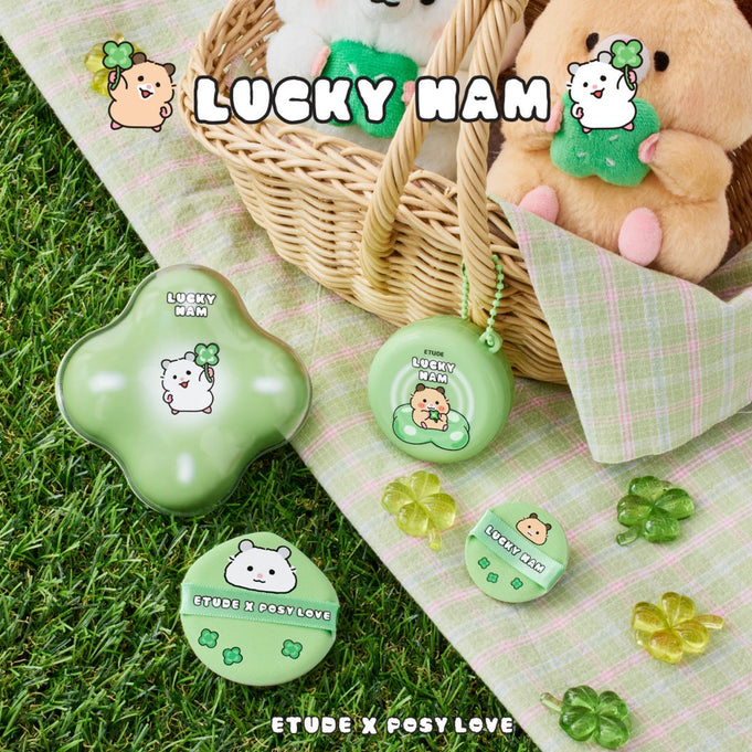 ETUDE Cloud Filter Cushion Set SPF42/PA+++ [Positive Love Edition] on grass with Lucky Ham themed packaging.