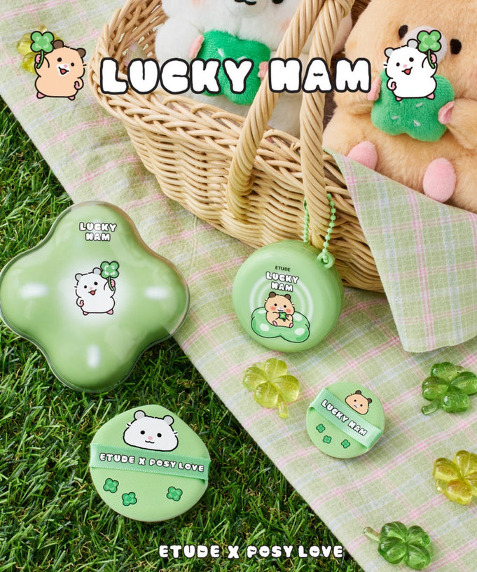 ETUDE Cloud Filter Cushion Set SPF42/PA+++ [Positive Love Edition] on grass with Lucky Ham themed packaging.