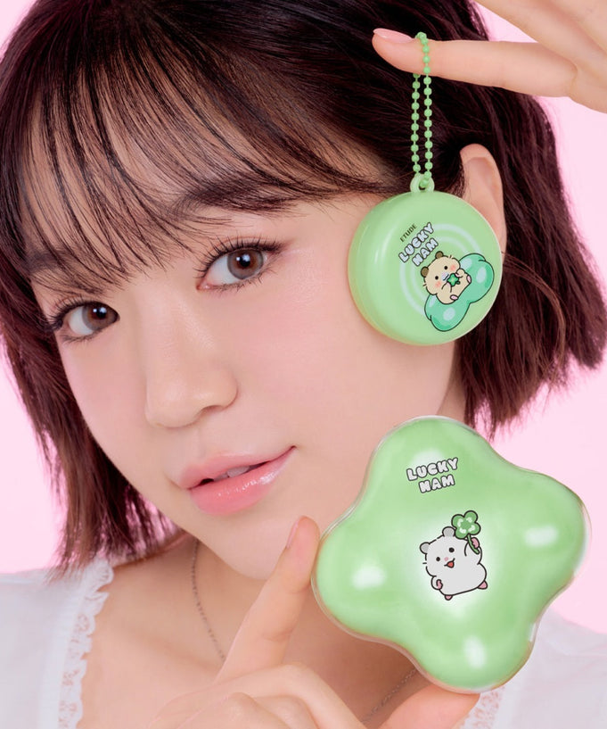 Woman holding ETUDE Cloud Filter Cushion Set SPF42/PA+++ in Positive Love Edition packaging, showcasing Lucky Ham design.