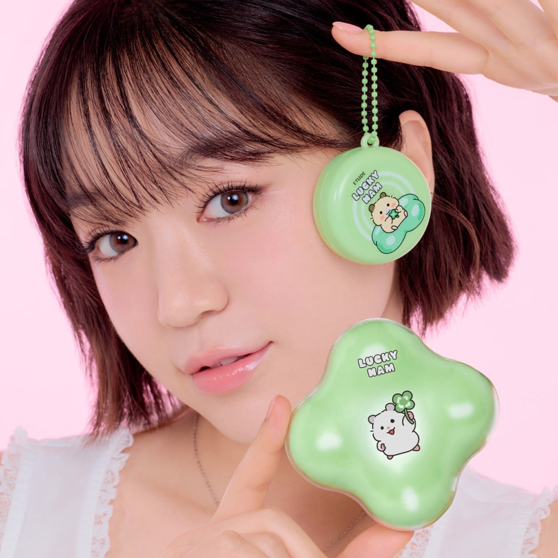 Woman holding ETUDE Cloud Filter Cushion Set SPF42/PA+++ in Positive Love Edition packaging, showcasing Lucky Ham design.