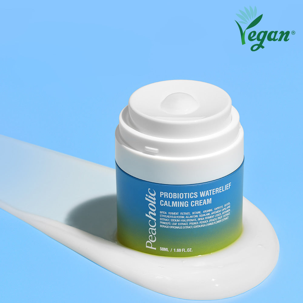 Image of PEACHOLIC Probiotics Water Relief Calming Cream 50ml with vegan label on a blue background.