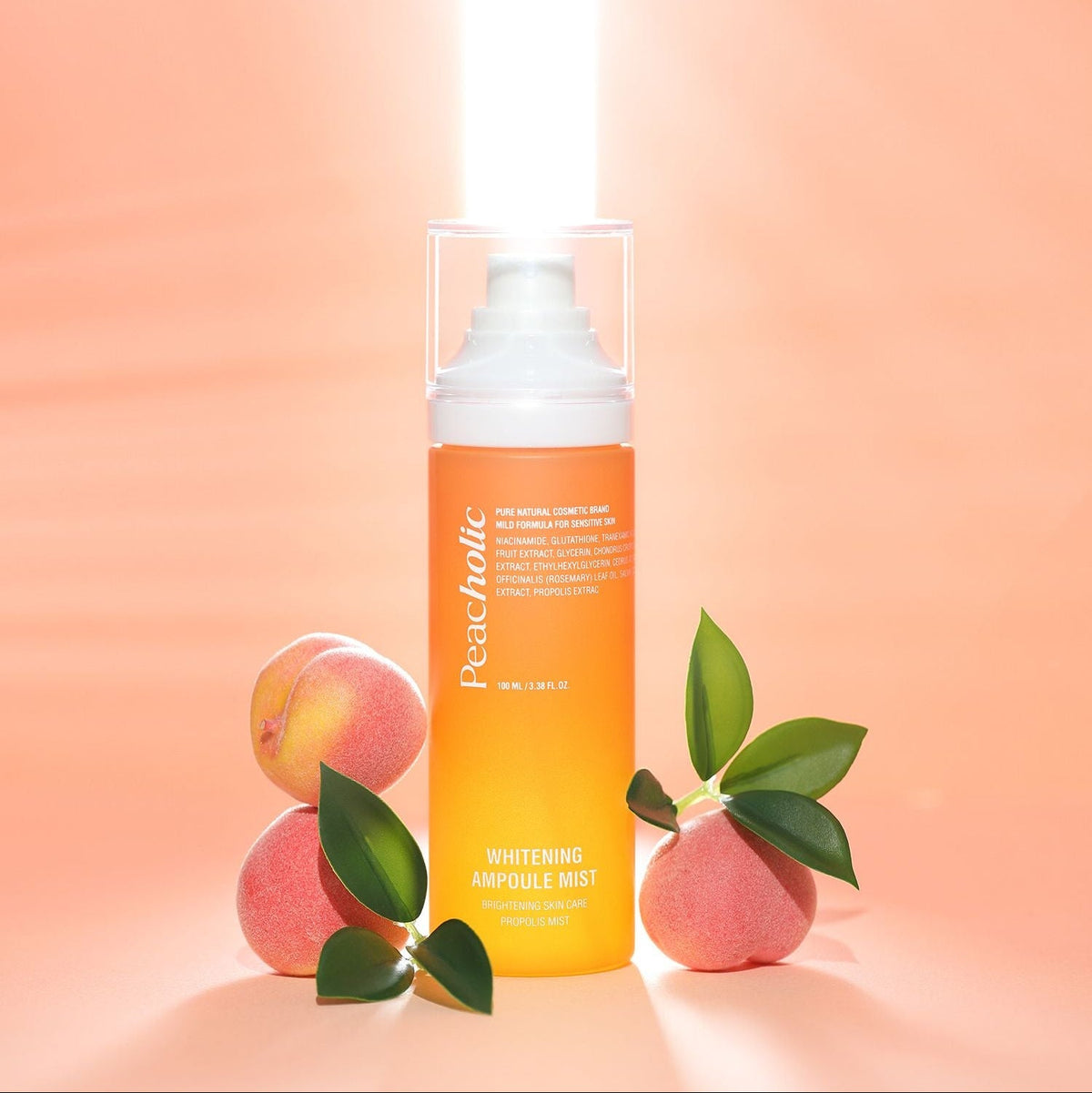 PEACHOLIC Whitening Ampoule Mist 100ml bottle with peaches on a peach-colored background