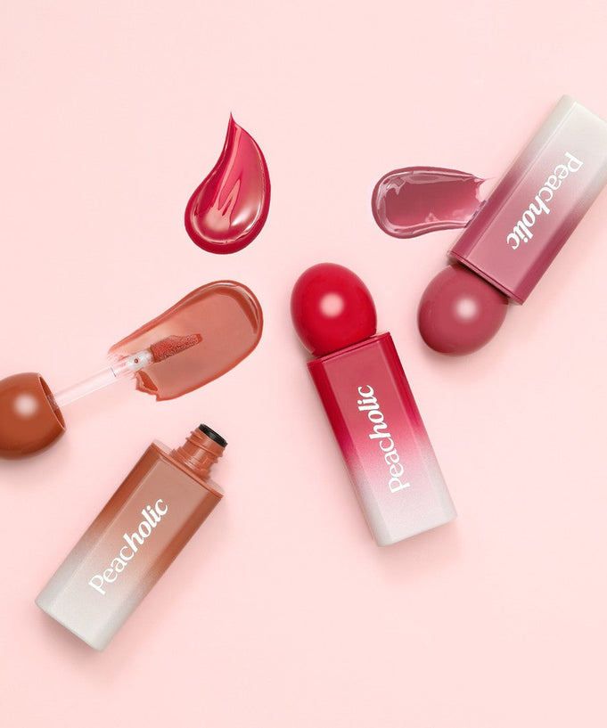 PEACHOLIC Water Glow Lip Tint in various shades on a pink background, showcasing vibrant color options and glossy texture.