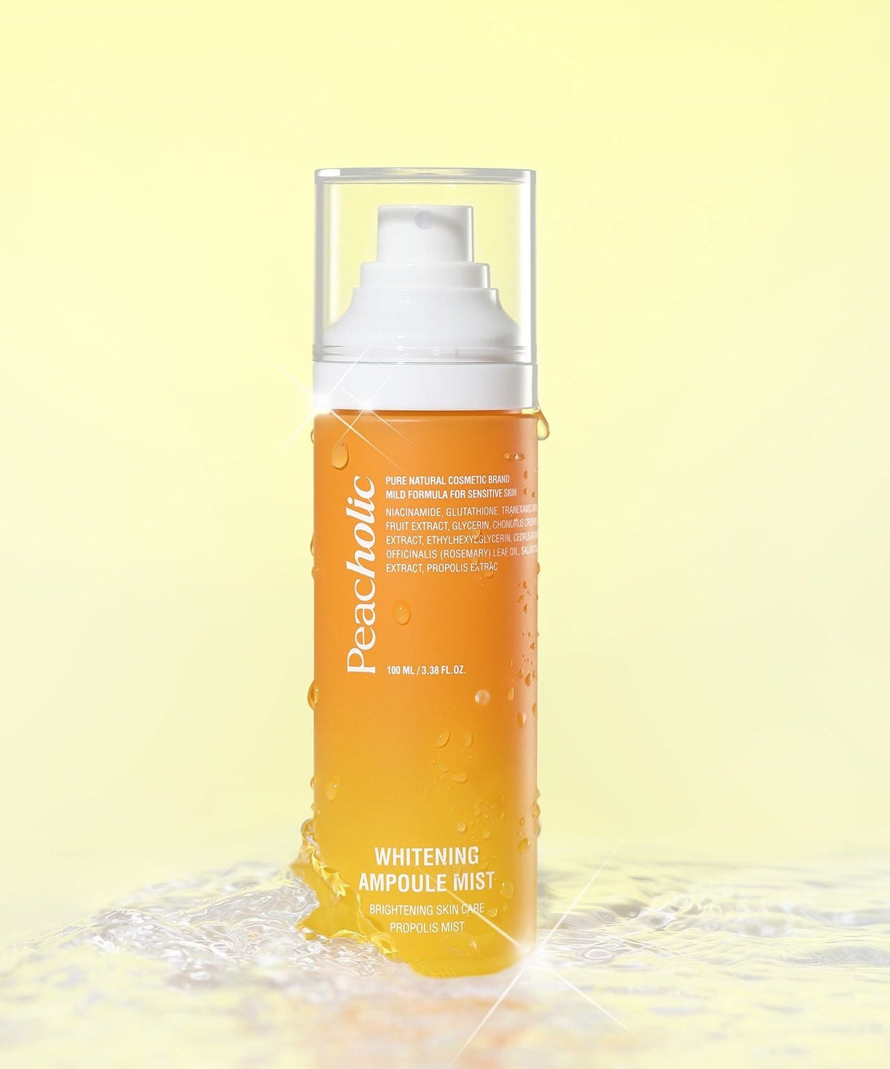 PEACHOLIC Whitening Ampoule Mist 100ml on a reflective surface with a yellow background, showcasing brightening benefits.