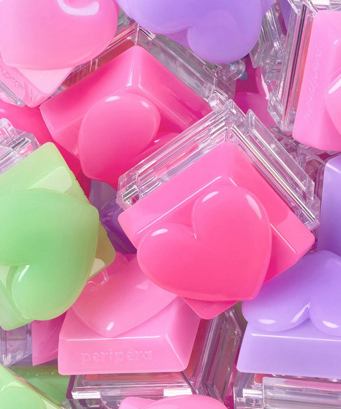 Colorful PERIPERA Talk Blush Keycap compacts with heart shapes, showcasing vibrant pink, green, and purple shades.