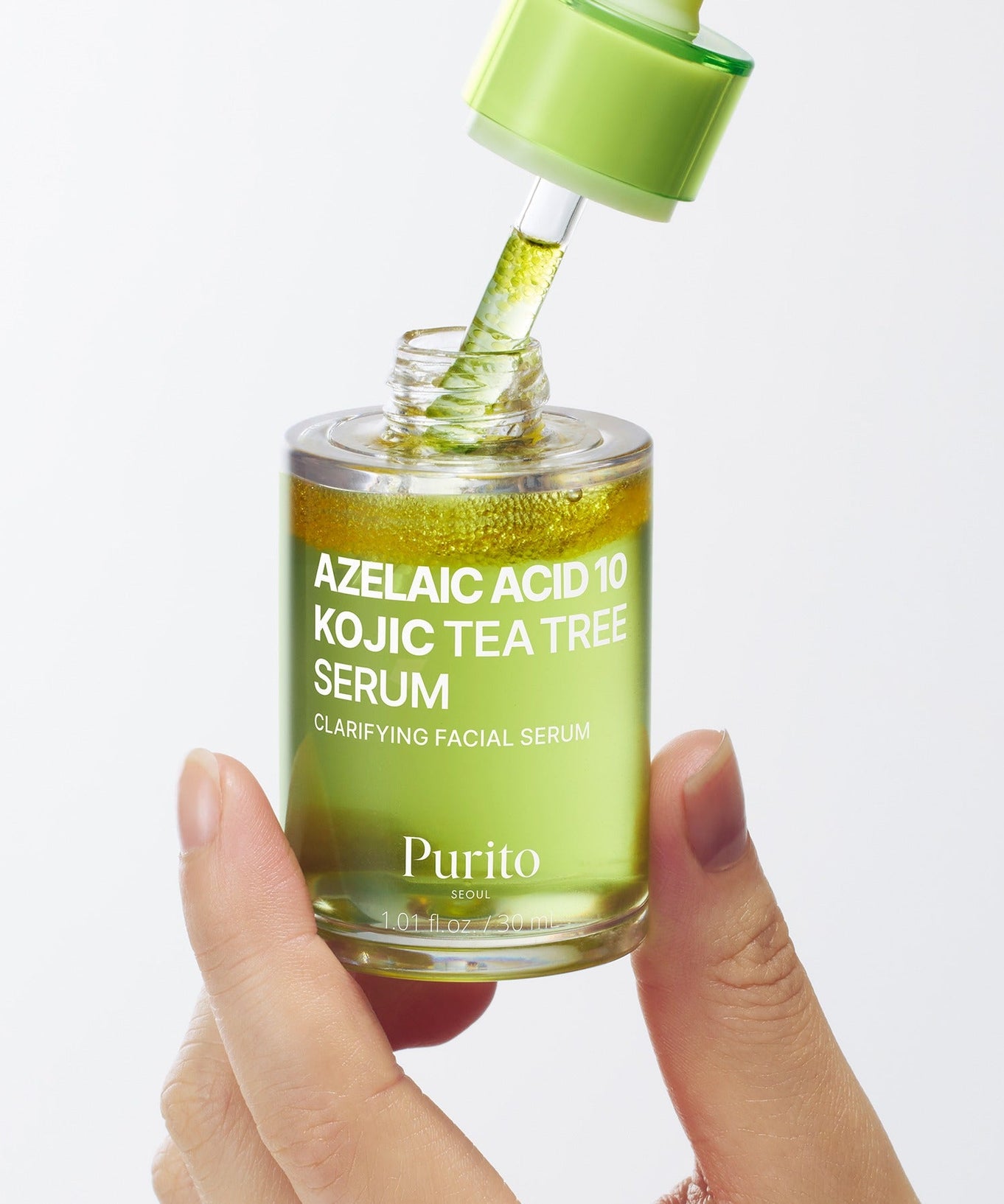 PURITO Azelaic Acid 10 Kojic Tea Tree Serum 30ml in a green bottle with dropper