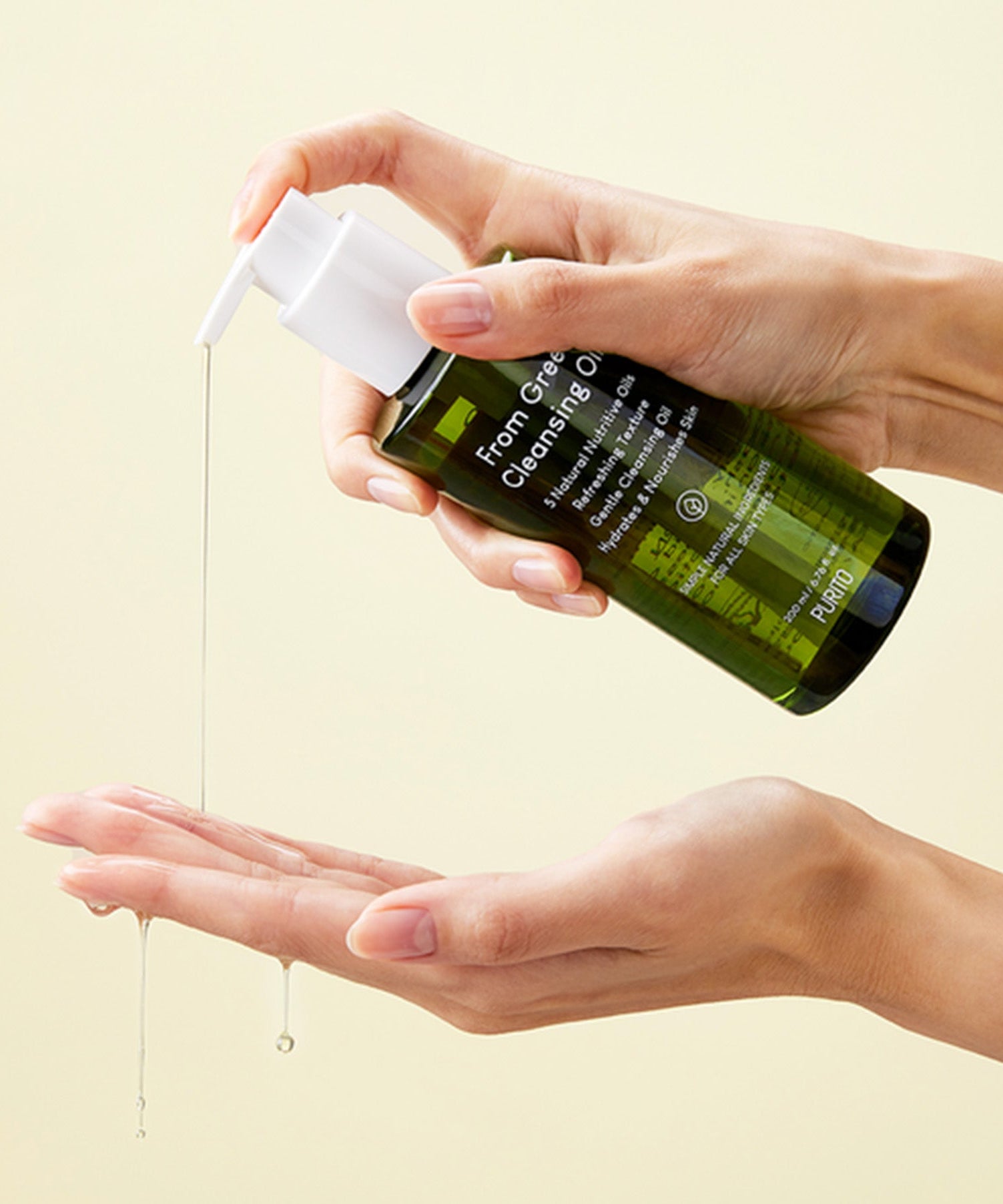 PURITO From Green Cleansing Oil 200ml being applied from a pump bottle