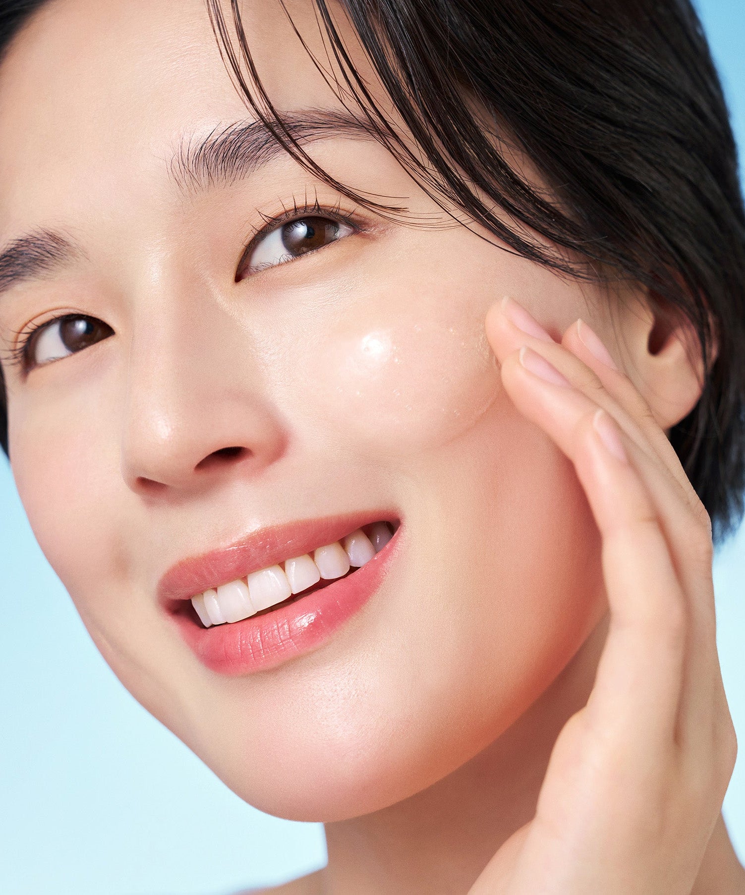 Person applying PURITO Hydro Wave Deep Sea Serum 60ml to smooth skin.