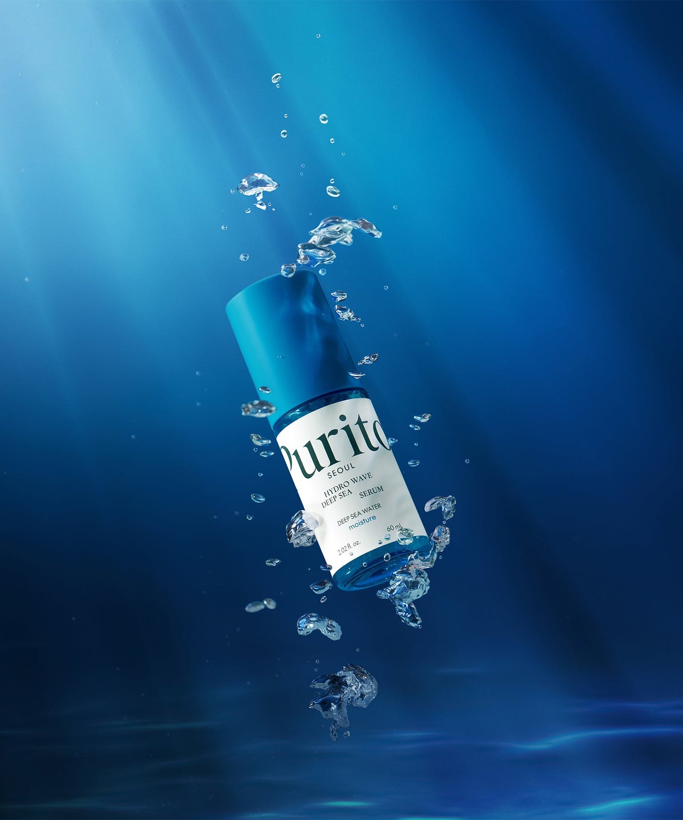 PURITO Hydro Wave Deep Sea Serum 60ml submerged in water with bubbles and deep blue background