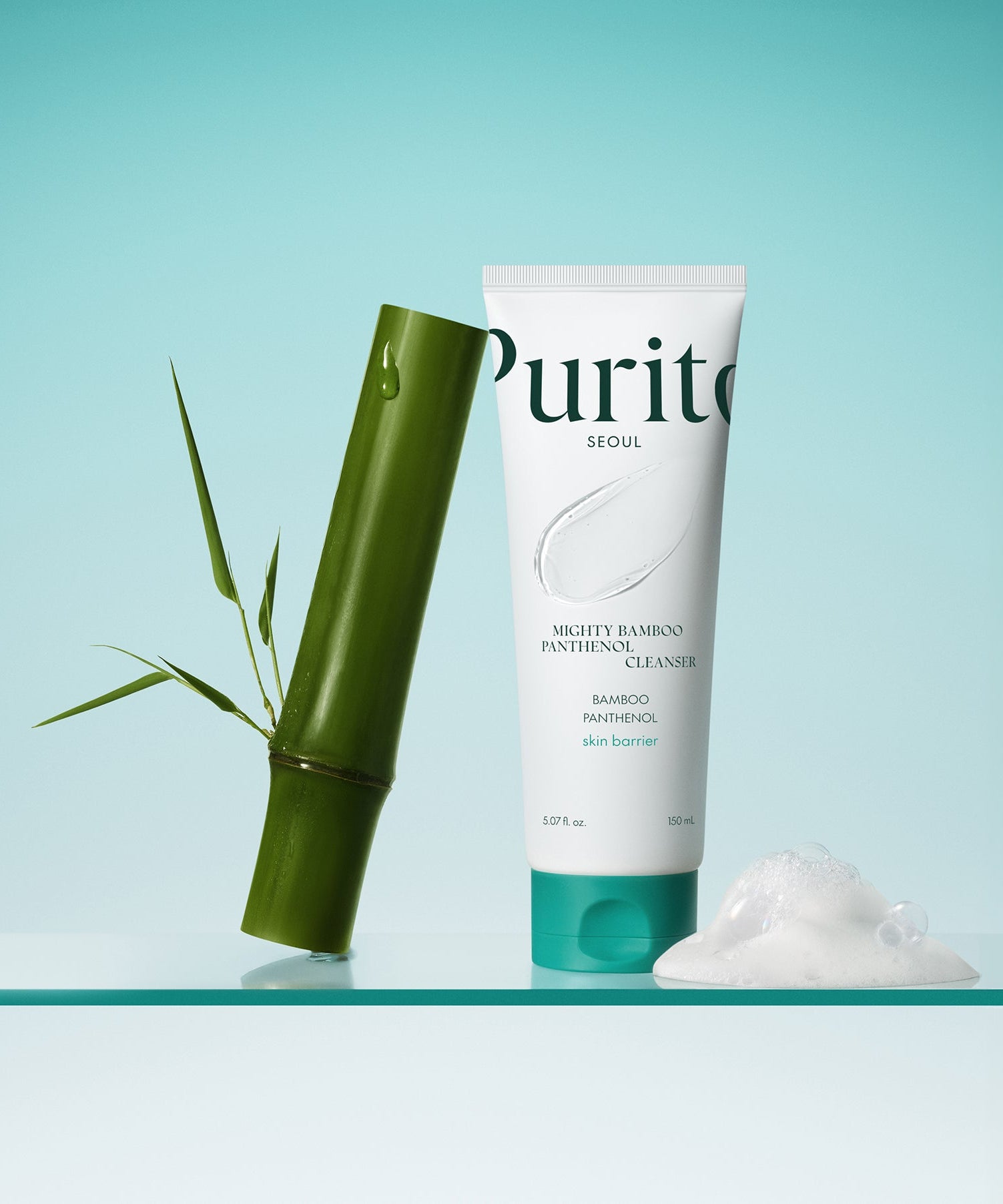 PURITO Mighty Bamboo Panthenol Cleanser 150ml with bamboo and foam on a reflective surface.