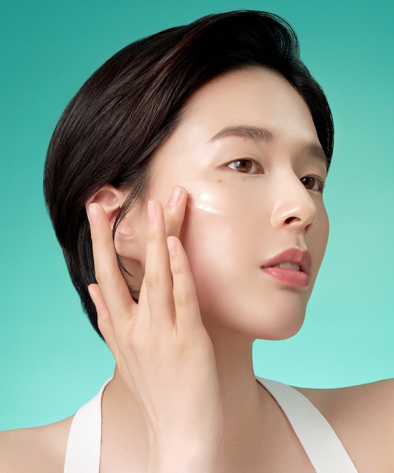 Woman applying PURITO Mighty Bamboo Panthenol Serum 30ml on skin, showcasing product use and benefits.