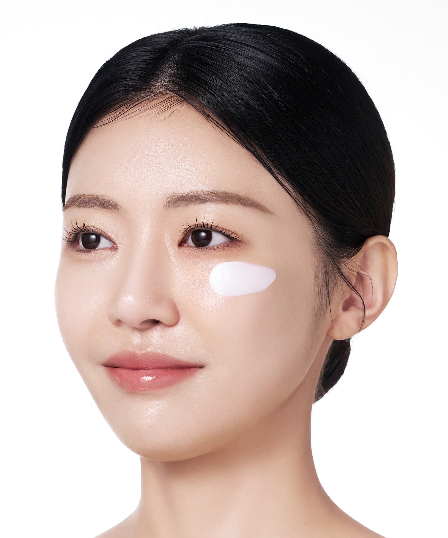Person applying PURITO Sunday Adventure Sunscreen SPF50 50ml on face for protection and skincare
