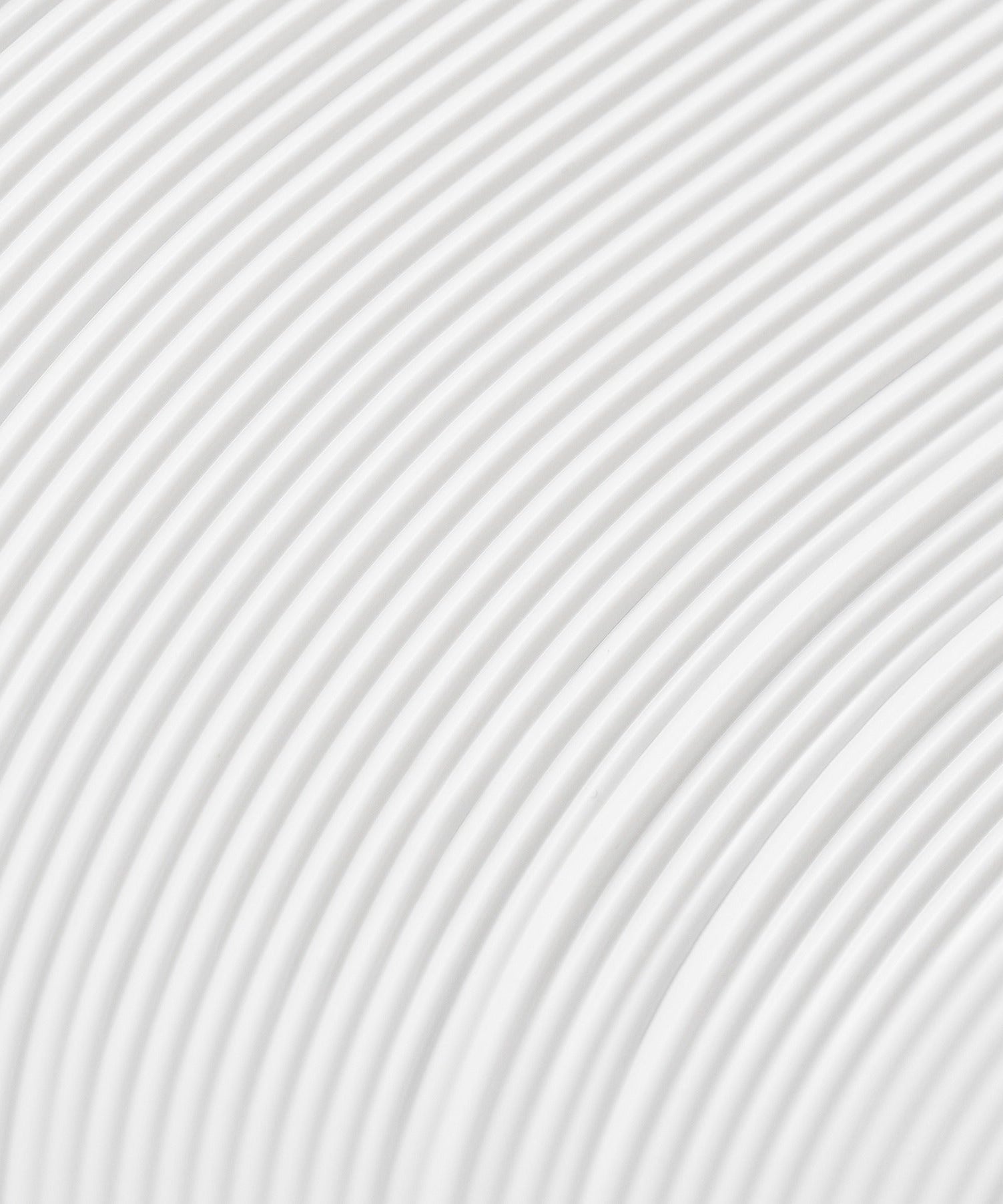 Abstract image of curved white lines forming a pattern on a light background.