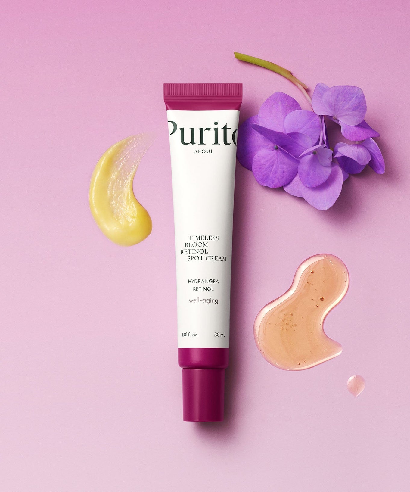 PURITO Timeless Bloom Retinol Spot Cream 30ml with floral and cream swatch accents on pink background